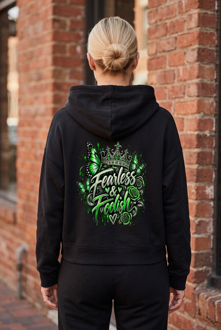 Back view of the black Emerald Crown hoodie with green crown, butterfly, rose, and Fearless & Foolish artwork.